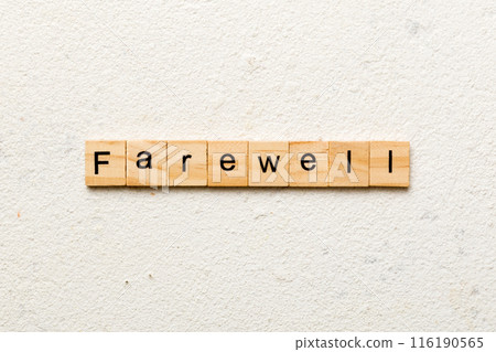farewell word written on wood block. farewell text on table, concept 116190565