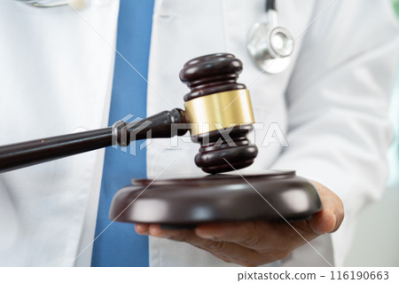 Doctor holding judge gavel, medical law and crime justice. 116190663