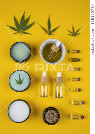 Set of cannabis oil bottles with hemp oil on yellow background. top view. flat lay 116190730