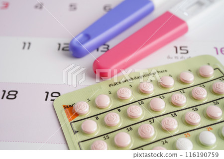 Pregnancy test and birth control pills on calendar, contraception health and medicine. Pregnancy test and birth control pills on calendar, contraception health and medicine. 116190759