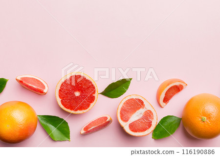 fresh Fruit grapefruit with Juicy grapefruit slices on colored background. Top view. Copy Space. creative summer concept. Half of citrus in minimal flat lay with copy space fresh Fruit grapefruit with Juicy grapefruit slices on colored background. Top view. Copy Space. creative summer concept. Half of citrus in minimal flat lay with copy space 116190886