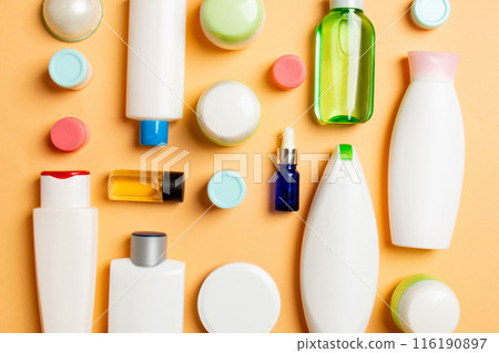 Group of plastic bodycare bottle Flat lay composition with cosmetic products on colored background empty space for you design. Set of White Cosmetic containers, top view with copy space Group of plastic bodycare bottle Flat lay composition with cosmetic products on colored background empty space for you design. Set of White Cosmetic containers, top view with copy space 116190897