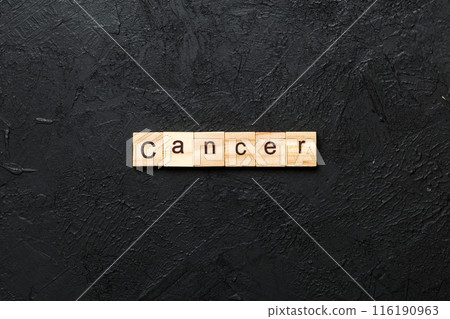 CANCER word written on wood block. CANCER text on cement table for your desing, concept 116190963
