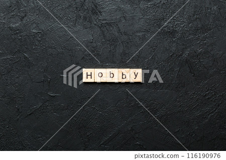 HOBBY word written on wood block. HOBBY text on cement table for your desing, concept 116190976