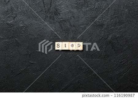 step word written on wood block. step text on table, concept step word written on wood block. step text on table, concept 116190987