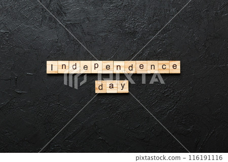 Independence Day word written on wood block. Independence Day text on table, concept Independence Day word written on wood block. Independence Day text on table, concept 116191116