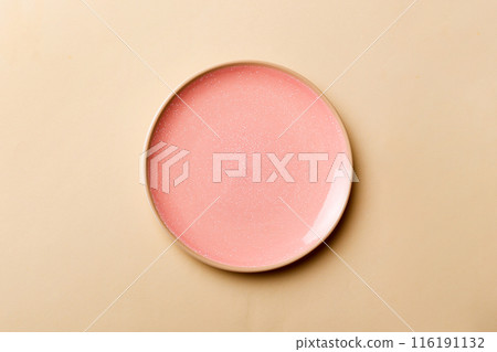 Top view of isolated of colored background empty round pink plate for food. Empty dish with space for your design 116191132