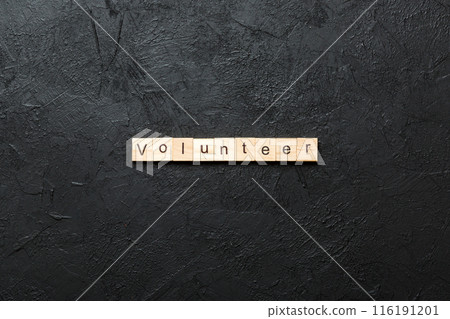 volunteer word written on wood block. volunteer text on table, concept volunteer word written on wood block. volunteer text on table, concept 116191201