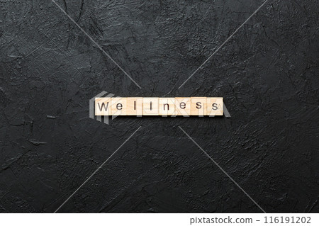 Wellness word written on wood block. Wellness text on cement table for your desing, concept Wellness word written on wood block. Wellness text on cement table for your desing, concept 116191202