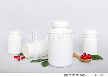 different drugs and health supplement pills with medicine bottle health care and medical top view. Vitamin tablets. Bottle with colored pills on table background. Multivitamins different drugs and health supplement pills with medicine bottle health care and medical top view. Vitamin tablets. Bottle with colored pills on table background. Multivitamins 116191203