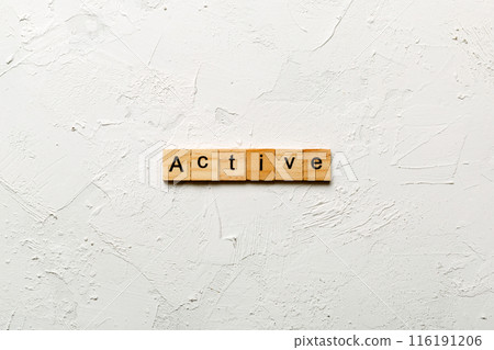 active word written on wood block. active text on table, concept 116191206