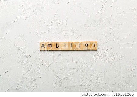 ambition word written on wood block. ambition text on cement table for your desing, concept ambition word written on wood block. ambition text on cement table for your desing, concept 116191209