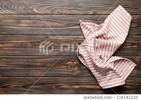 top view with red empty kitchen napkin isolated on table background. Folded cloth for mockup with copy space, Flat lay. Minimal style top view with red empty kitchen napkin isolated on table background. Folded cloth for mockup with copy space, Flat lay. Minimal style 116191210