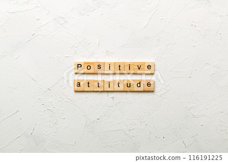 Positive Attitude word written on wood block. Positive Attitude text on cement table for your desing, concept Positive Attitude word written on wood block. Positive Attitude text on cement table for your desing, concept 116191225