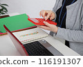 A woman with beautiful hands working 116191307