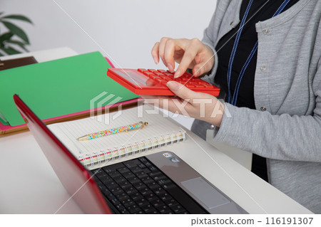 A woman with beautiful hands working 116191307