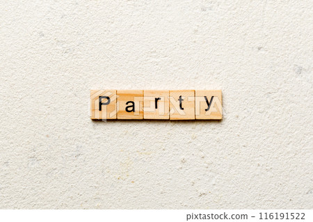 PARTY word written on wood block. PARTY text on cement table for your desing, concept 116191522