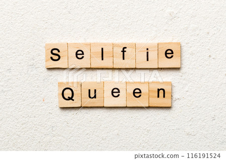 Selfie Queen word written on wood block. Selfie Queen text on cement table for your desing, concept Selfie Queen word written on wood block. Selfie Queen text on cement table for your desing, concept 116191524