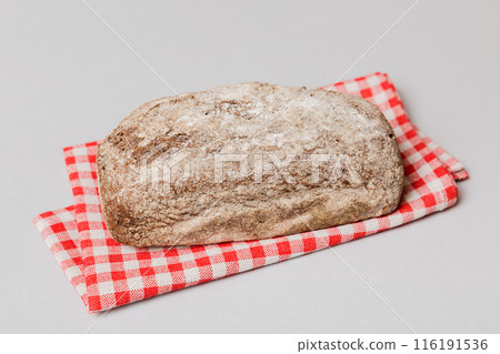 freshly baked bread with napkin on rustic table top view. Healthy white bread loaf isolated freshly baked bread with napkin on rustic table top view. Healthy white bread loaf isolated 116191536