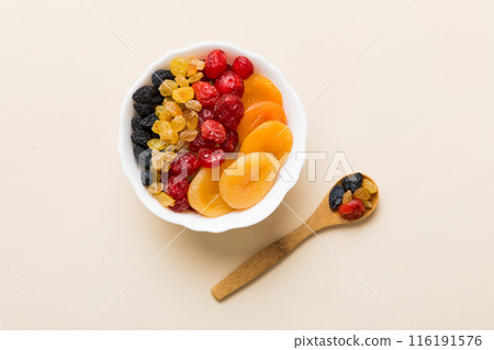 Bowl with different dried fruits on table background, top view. Healthy lifestyle with copy space Bowl with different dried fruits on table background, top view. Healthy lifestyle with copy space 116191576