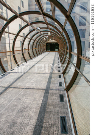 Foofbridge tunel made from piles and glass with abstract design. Foofbridge tunel made from piles and glass with abstract design. 116191658