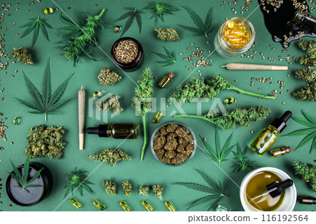 Flat lay, Top view of marijuana leaves and cannabis buds, cbd concept Flat lay, Top view of marijuana leaves and cannabis buds, cbd concept 116192564