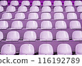 Empty rows of purple stadium seats in an outdoor setting, texture, background. 116192789