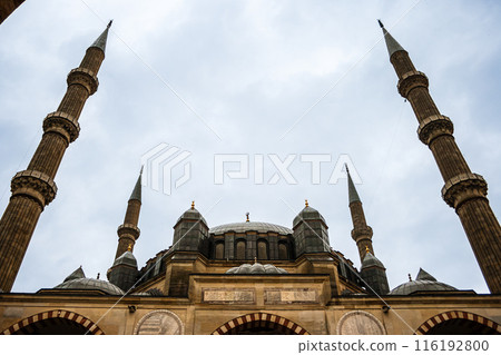 Low angle view of a mosque with four tall minarets against a cloudy sky, Mosque of Selim II, Edirne, Turkey. Low angle view of a mosque with four tall minarets against a cloudy sky, Mosque of Selim II, Edirne, Turkey. 116192800