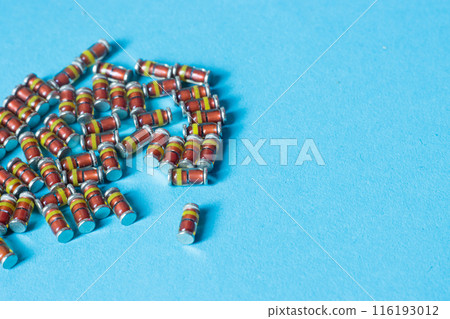 SMD diodes, on a table with a blue background, electronic components 116193012