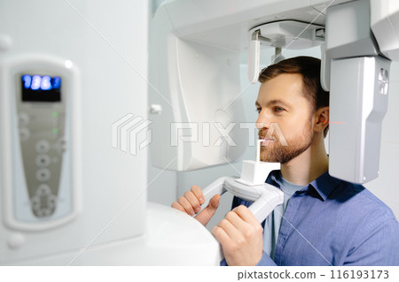 Panoramic image of teeth. A patient in a modern dental clinic takes a panoramic picture of the teeth. Prevention of dental diseases. Accurate diagnosis. 116193173