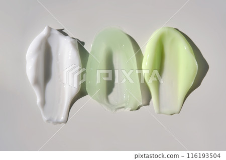 Texture of cosmetic creams with rosemary on a gray background. 116193504