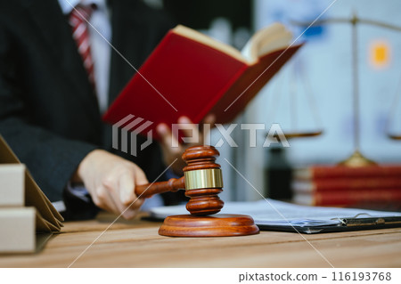 Male lawyer working at table at home office in the morning. 116193768