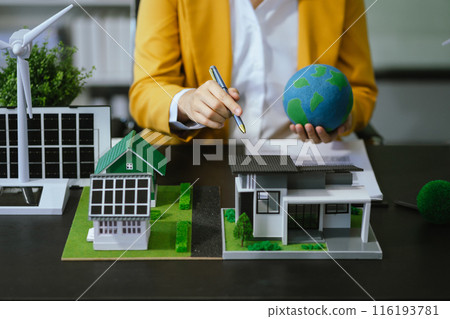Businessman team brainstorming using tablet, laptop computer for working technology and business, Renewable energy-based green businesses and global warming. Reduce CO2 emission. Businessman team brainstorming using tablet, laptop computer for working technology and business, Renewable energy-based green businesses and global warming. Reduce CO2 emission. 116193781
