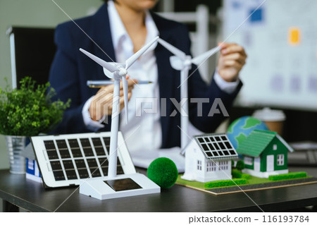 Businessman team brainstorming using tablet, laptop computer for working technology and business,  Renewable energy-based green businesses and global warming. Reduce CO2 emission. 116193784