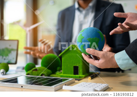 Businessman team brainstorming using tablet, laptop computer for working technology and business,  Renewable energy-based green businesses and global warming. Reduce CO2 emission. 116193812