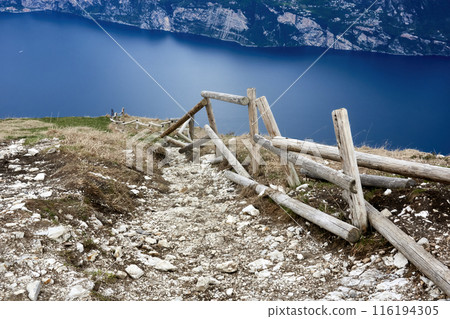 Repair-Needed Wooden Railing on Hiking Trail from Monte Baldo to Lake Garda Repair-Needed Wooden Railing on Hiking Trail from Monte Baldo to Lake Garda 116194305