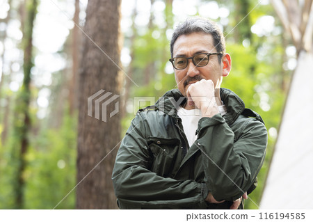 A cool man in his 50s thinking 116194585