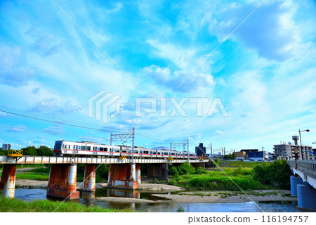 Aichi Prefecture: Nagoya cityscape - A train on the Meitetsu Seto Line crossing the Yatagawa Bridge Aichi Prefecture: Nagoya cityscape - A train on the Meitetsu Seto Line crossing the Yatagawa Bridge 116194757
