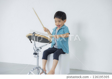 Kids playing drum practice pads Kids playing drum practice pads 116195305