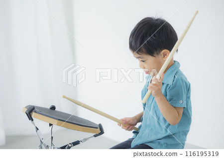 Kids playing drum practice pads 116195319