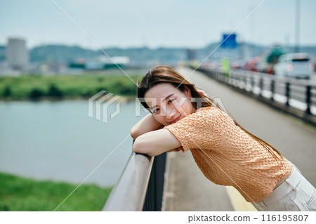 A young woman looking at the camera A young woman looking at the camera 116195807