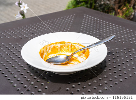 Food remains in plate, red leftovers, smeared sauce after lunch or dinner. Empty dirty plates, food waste 116196151