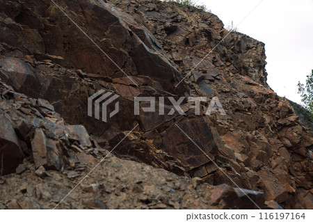 Rock falling apart into small stones Rock falling apart into small stones 116197164