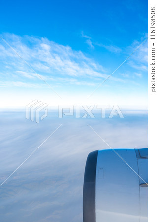 Blue sky seen from the window of the plane 116198508