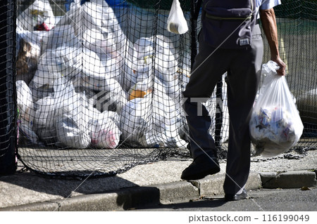Yokohama cityscape in Japan. Taking out the trash...Trash bags (burnable trash) pile up at the trash dump (garbage collection area)...=Yokohama city 116199049