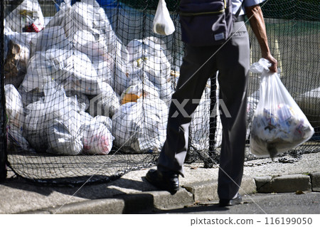 Yokohama cityscape in Japan. Taking out the trash...Trash bags (burnable trash) pile up at the trash dump (garbage collection area)...=Yokohama city 116199050