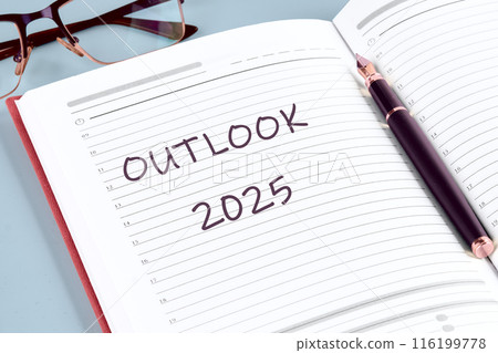 Economic outlook concept. Financial, business review or economic growth forecast for 2025. OUTLOOK 2025 in the notebook of a businessman, manager 116199778
