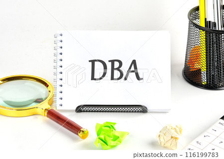 DBA short for Data Base Administrator. DBA written on a blank sheet of a desk notebook DBA short for Data Base Administrator. DBA written on a blank sheet of a desk notebook 116199783