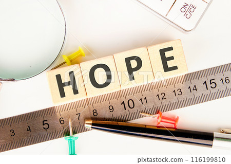 hope word - word abstract in wooden letter cubes Positivity, faith and optimism concept. HOPE on wooden cubes laid out along the measuring ruler 116199810