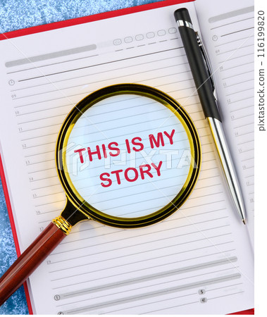 My story symbol. Words THIS IS MY STORY viewed through a magnifying glass in a business notebook My story symbol. Words THIS IS MY STORY viewed through a magnifying glass in a business notebook 116199820